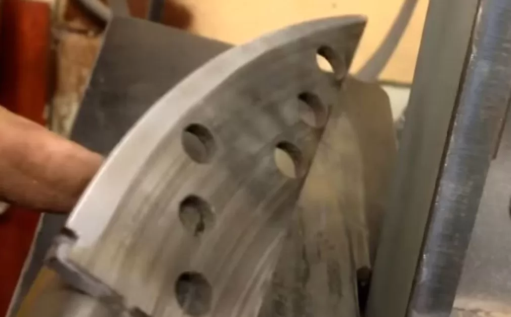 Grinding the edge of a brake rotor knife